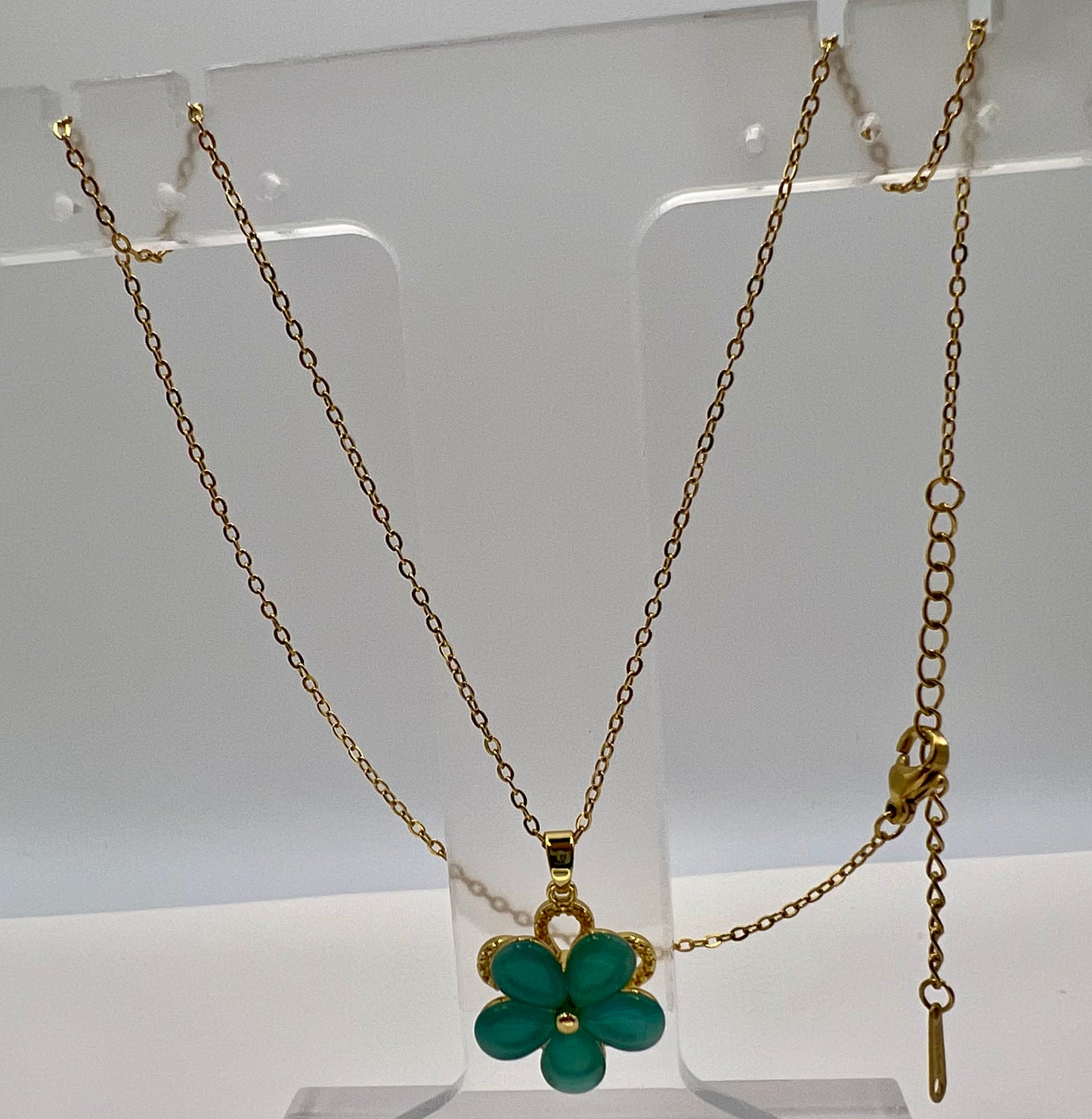 Beautiful teal flower rotating necklace