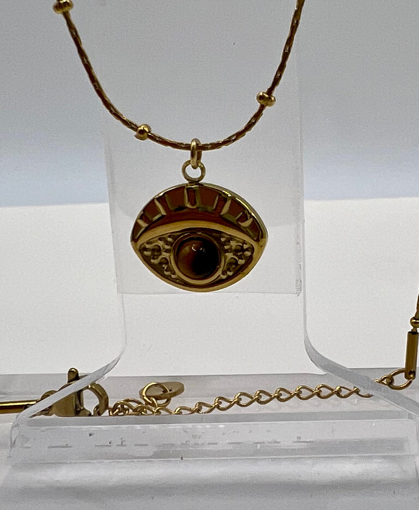 Golden necklace eye