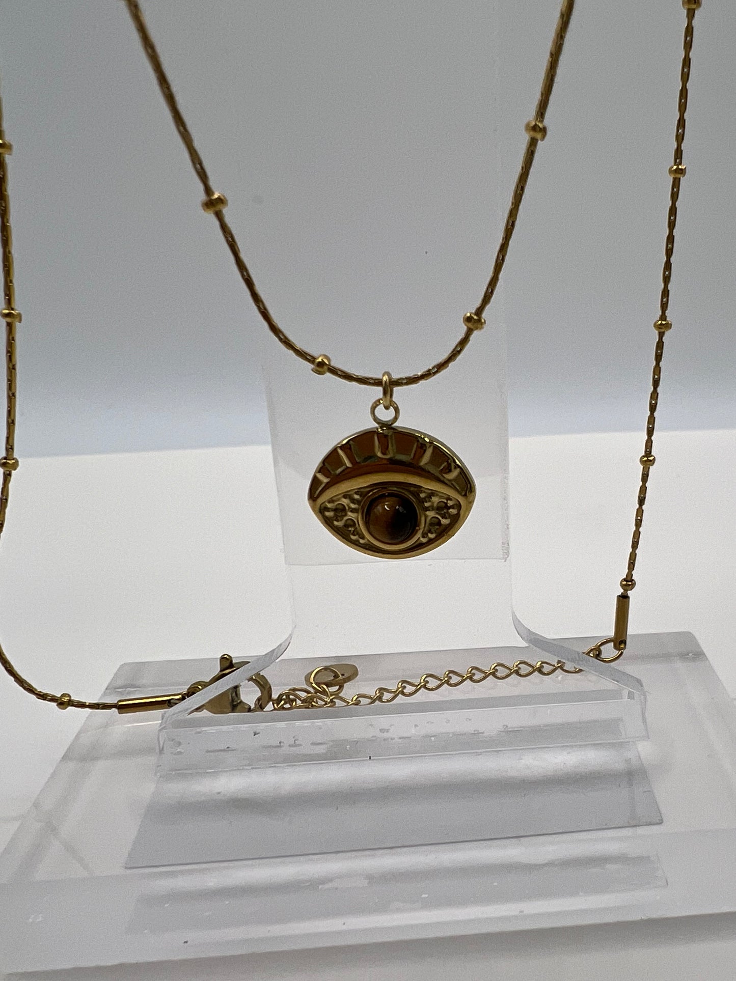 Golden necklace eye